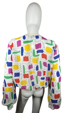 Load image into Gallery viewer, This Vintage Gailord 80&#39;s top boasts colorful sheer material and playful shapes all over. Measured flat, it has a chest of 36&quot;, sleeves of 25&quot;, and a length of 21&quot;.