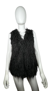 The H&M Black Faux Fur vest comes with pockets, measuring 32" in the chest and 24" in length.