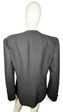 Load image into Gallery viewer, Experience the timeless allure of our Vintage Blazer with tassels. Wrap yourself in elegance and grace with its buttoned closure and intricate button detailing on the sleeves. Please note that this garment has a delicate light stain on the front. Measu...