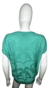 Score a totally adorable vintage 80's Herald Place knit top in seafoam green, complete with a playful floral design and in excellent condition.