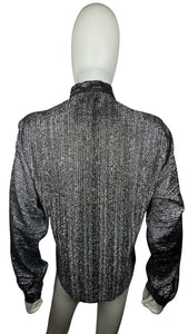 Experience the ultimate 70's vibe with this shiny sparkly Lame' lurex fabric silver button party top from Judy Bond. Don't let the pictures deceive you, it's even better in person. Measured Flat Chest - 38" Sleeve - 25" Waist - Length - 29".