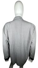 Load image into Gallery viewer, Experience the timeless style and sophistication of the Vintage Marnie Houndstooth 80s Blazer. This stunning black and white blazer features two front pockets, a single front button, and stylish black cuffs on the sleeves. With a measured flat chest of...