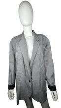 Load image into Gallery viewer, Experience the timeless style and sophistication of the Vintage Marnie Houndstooth 80s Blazer. This stunning black and white blazer features two front pockets, a single front button, and stylish black cuffs on the sleeves. With a measured flat chest of...
