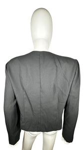 Introducing the Vintage Leslie Fay Black Crop Blazer - the perfect combination of chic and playful! This blazer features a front button closure, satin bow detail, and shoulder pads, along with measurements of 35" chest, 22" sleeves, and 21" length when...