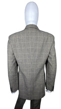Load image into Gallery viewer, A unique throwback Liz Claiborne collection featuring a luxurious wool tweed suit adorned with houndstooth pattern. This suit comes with a blazer and pants set, with measurements of blazer chest at 30 inches, sleeve at 23 inches, and length at 29.5 inc...