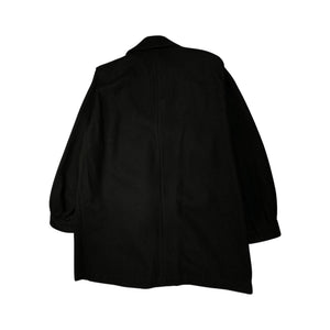 This pristine vintage Donny Brook peacoat is made of rare heavy black wool, featuring magnificent lion head bronze buttons. Measuring at 46 inches across the chest, with 25-inch sleeves and a length of 40 inches, it is a true gem.