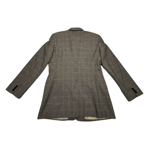 A unique throwback Liz Claiborne collection featuring a luxurious wool tweed suit adorned with houndstooth pattern. This suit comes with a blazer and pants set, with measurements of blazer chest at 30 inches, sleeve at 23 inches, and length at 29.5 inc...