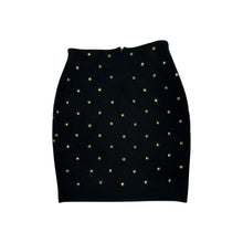 Load image into Gallery viewer, This is a Vintage Outlander Collection Skirt from the 80&#39;s thats a high waisted black skirt with metal gold studs all over that zips in the back. Measured Flat Waist - 28&quot; Hips - 36&quot; Length - 21&quot;