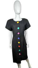 Load image into Gallery viewer, The Vintage 80&#39;s Rare Find David Mitchell Dress boasts a black hue and bold, vibrant oversized buttons. With measurements of Chest - 35&quot;, Hips - 34&quot;, and Length - 43&quot;, this dress offers a fun and unique twist to the classic little black dress.