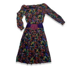 Load image into Gallery viewer, Vintage Patty O&#39;neil by Monique Robidoux Floral Dress is a purple long sleeve dress with an all over floral print and built in suede belt. Measured Flat Chest - 38&quot; Sleeve - 25&quot; Waist - 26&quot; Hips - 34&quot; Length - 49&quot;
