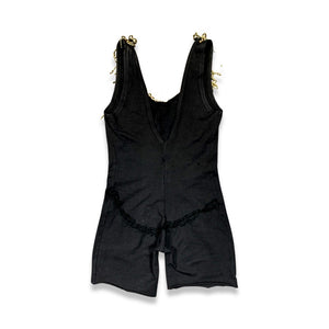 This Vintage Black and Gold Beaded Leotard has a stretchy and comfortable feel. Although it may show some wear and tear, it still holds its unique charm with a few holes and a missing bead on the chest. In the past, I had a skirt attached to the back t...