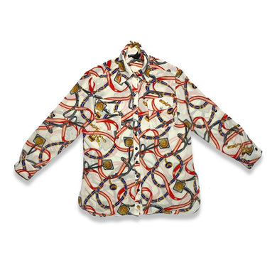The Mishca Blouse features a charming chain print and delightful long sleeves, creating a playful and unique look. Measurements are as follows: Chest - 40