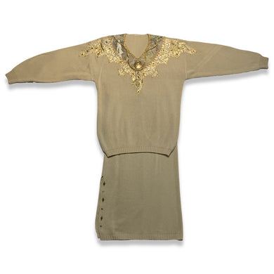 Get that 80's vibe with this matching set! A fab sweater and a stretchy skirt, both embellished with gold accents. Measurements for Top - 40