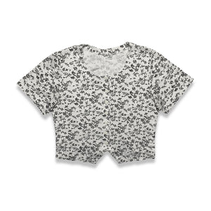 Experience a touch of nostalgia with our Vintage Black and White Floral Crop Top - the perfect blend of old and new. This short sleeve button-up piece features a chest measurement of 34" and a length of 19", giving you a flattering fit.