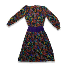 Load image into Gallery viewer, Vintage Patty O&#39;neil by Monique Robidoux Floral Dress is a purple long sleeve dress with an all over floral print and built in suede belt. Measured Flat Chest - 38&quot; Sleeve - 25&quot; Waist - 26&quot; Hips - 34&quot; Length - 49&quot;