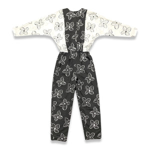 Introducing a one-of-a-kind black and white floral jumpsuit from the 80's, complete with a stretch waist for ultimate comfort. Measurements include: Chest - 39", Sleeve - 24", Waist - 26", Hips - 40", Inseam - 28", Length - 60". Don't miss this rare vi...